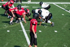 American high school football player getting ready to go out for a pass.